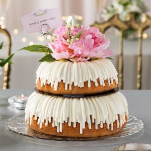 Wedding cake with two layer and a bouquet flower on top Weddings