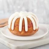 Gluten free lemon raspberry Bundtlet showing topped with signature frosting