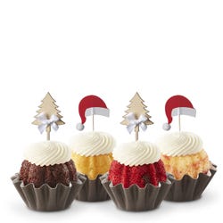 Each Bundtini&reg; is adorned with a festive topper: two feature silver Christmas tree decorations and the other two have red Santa hats.