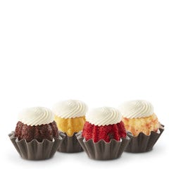 Assorted flavor Cupcake sized bundt cakes (Bundtinis®) topped with cream cheese frosting.