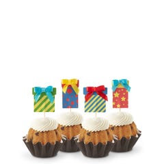 Bundtinis with frosting and birthday present toppers with different celebratory designs.