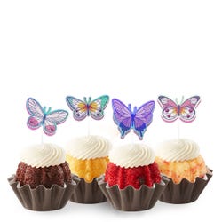 Bundtinis&reg; topped with frosting and decorated with purple, green, pink sparkled butterflies.
