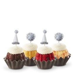 Mini Bundt cakes (Bundtinis&reg;) each topped with creamy white frosting and adorned with silver party hats and matching silver pom-poms.