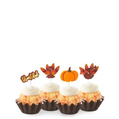 New! White Chocolate Raspberry Thankful Turkey Bundtinis® topped with frosting and decorated with pumpkin and turkey toppers as well as a topper with Thankful written in cursive.